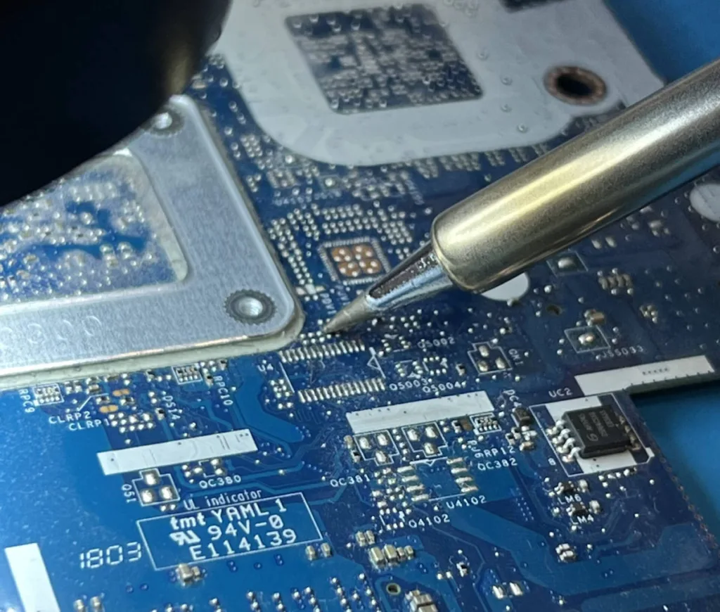 soldering on a motherboard and repairing capacitors and replacing ports